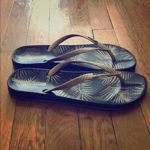 Ipanema black and gold flip flops